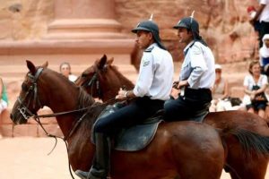 Two officers riding horses.